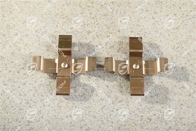 Front axle fixed caliper spring, brake pad mouting